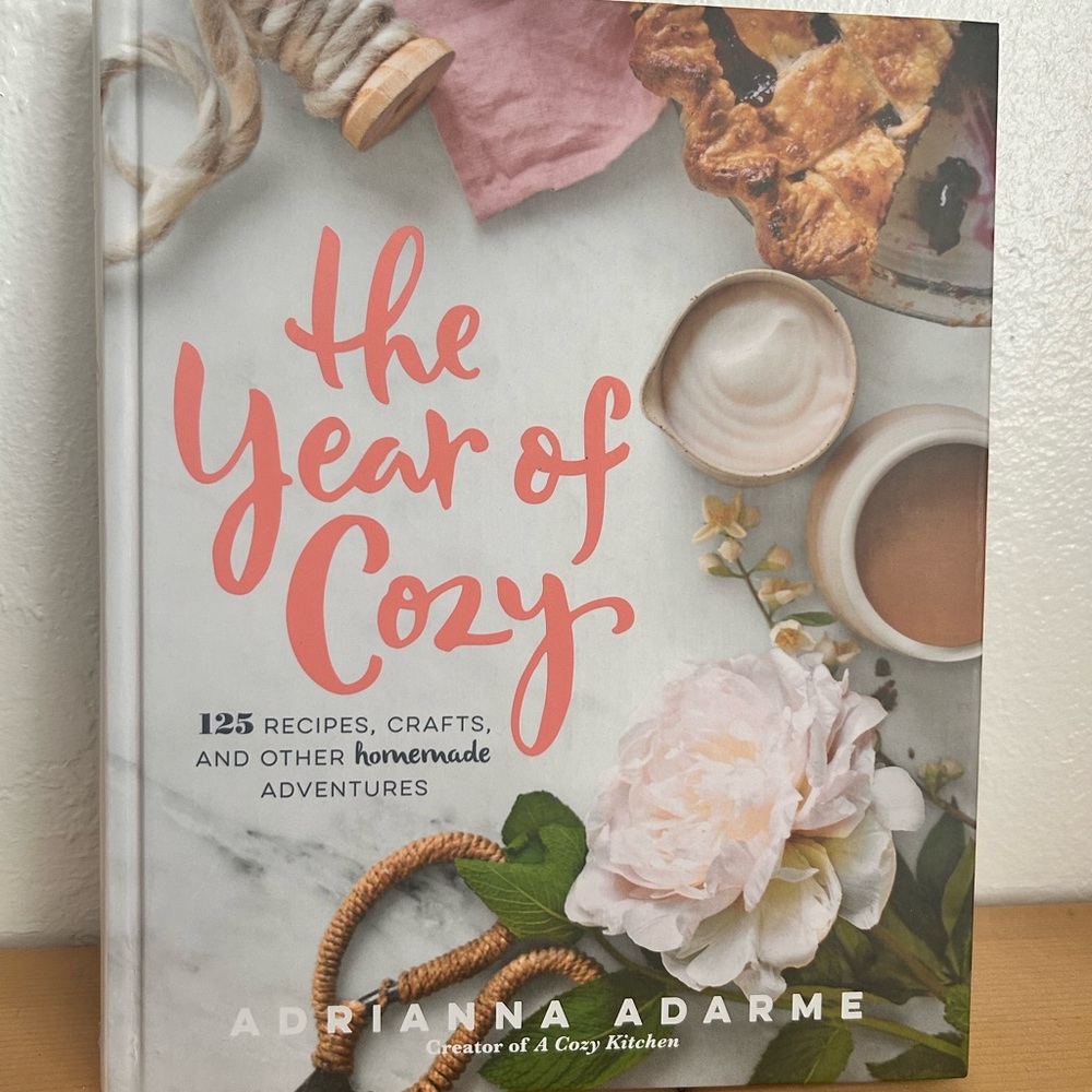 The Year of Cozy Cookbook by Adrianna Adarme - Coral & White Cover
